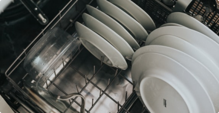 plates loaded into a dishwasher
