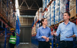 Workers checking stock in a warehouse